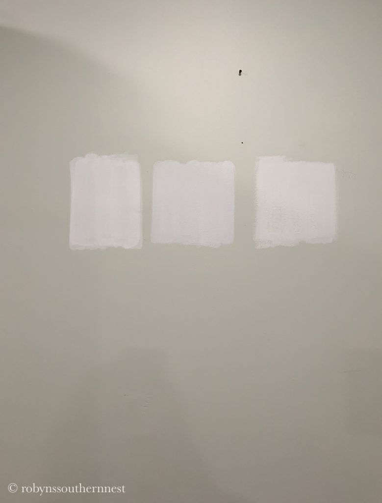 White paint swatches on the wall 