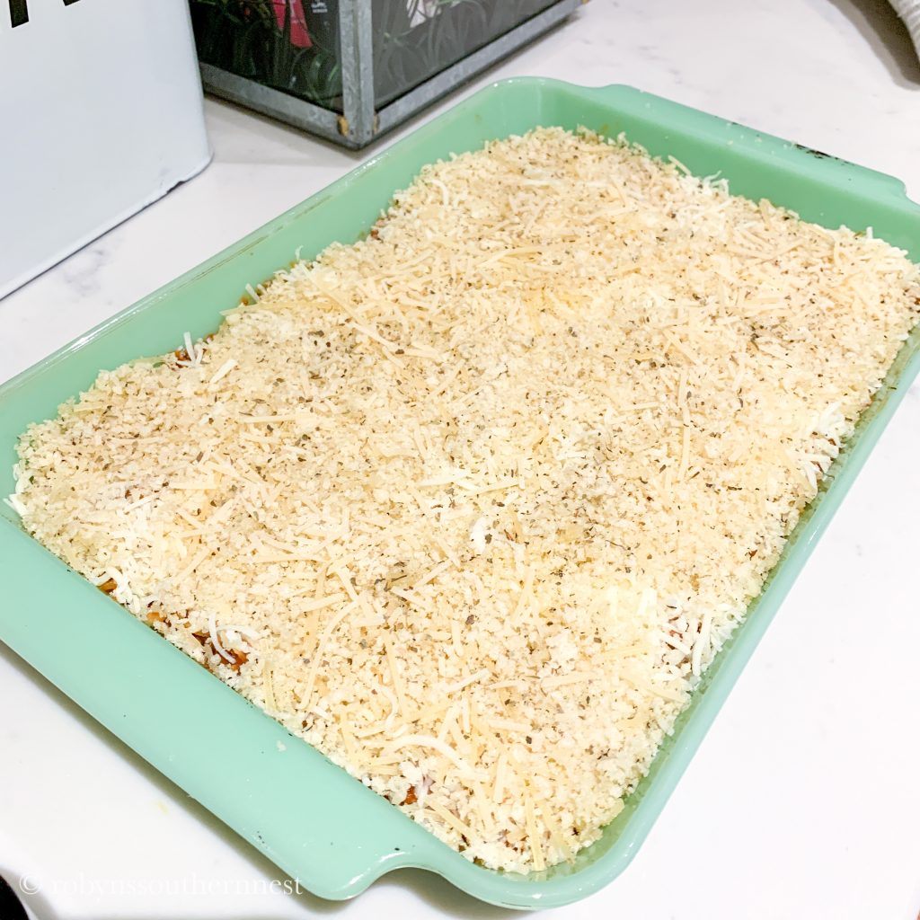 spread the breadcrumb and cheese mixture over the entire top of the baking dish 