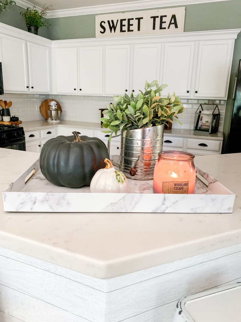 marble tray with pumpkins and candle 