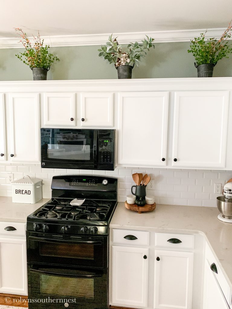 Fall florals above kitchen cabinets 
