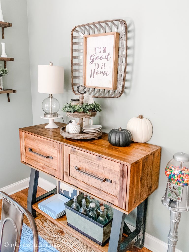 sideboard with tiered tray and pumpkins 