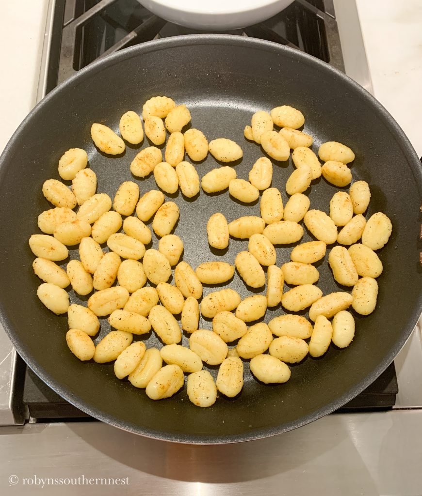 sauteing gnocchi in a pan 