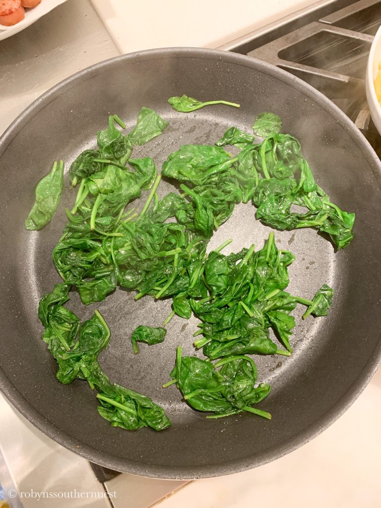 wilting spinach in a pan 