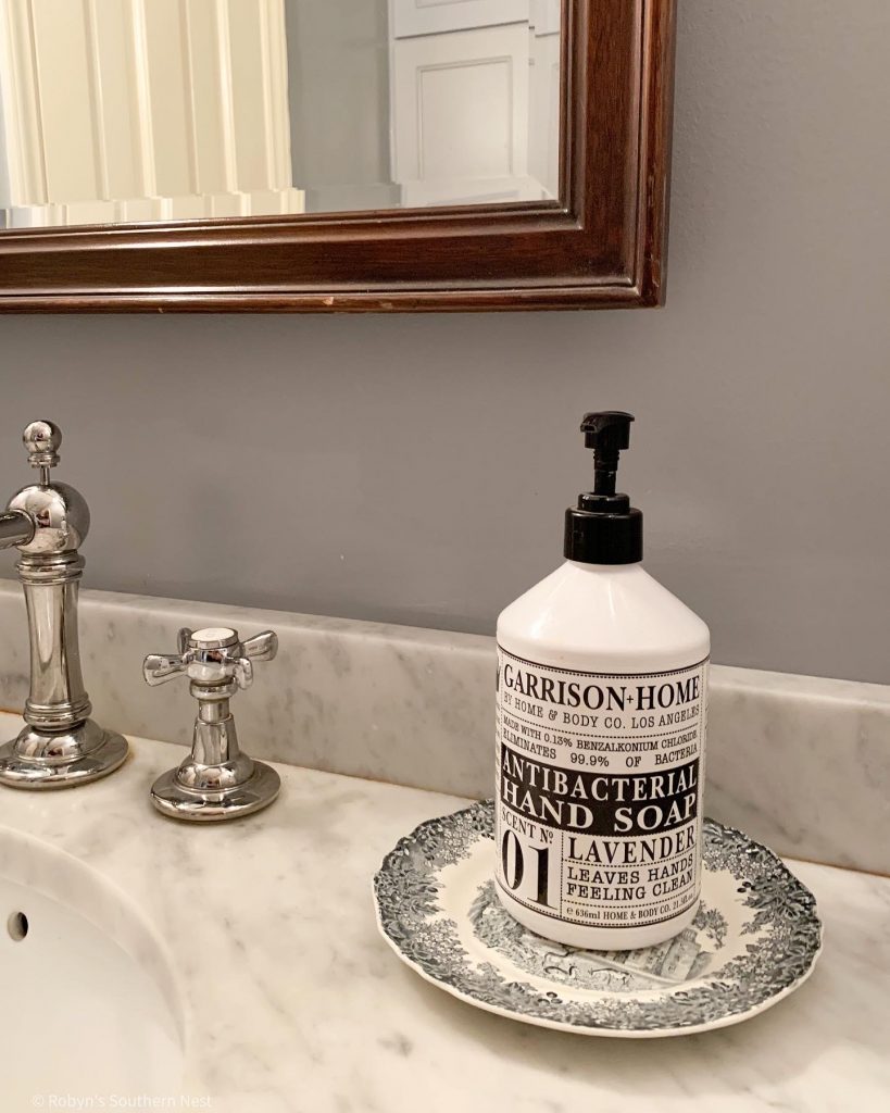 black and white dish under soap dispenser